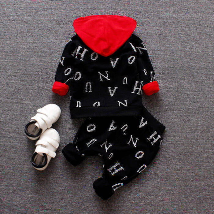 817325240184.jpg A happy child wearing a comfortable kids 2 piece long sleeve outfit for everyday play from K&K Trend Wear.