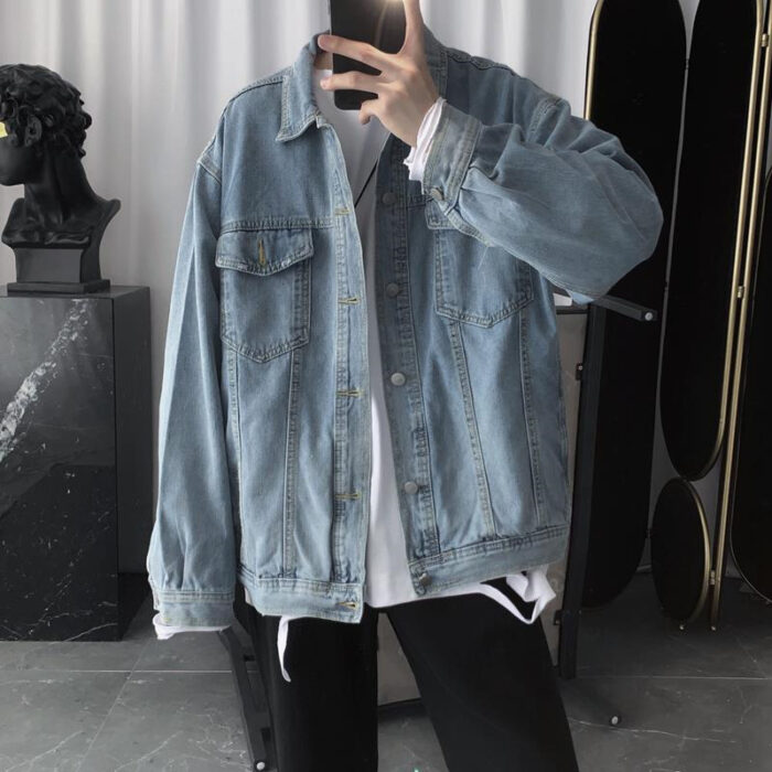 A stylish man wearing a versatile mens vintage wash denim jacket for an effortless streetwear look from K&K Trend Wear.