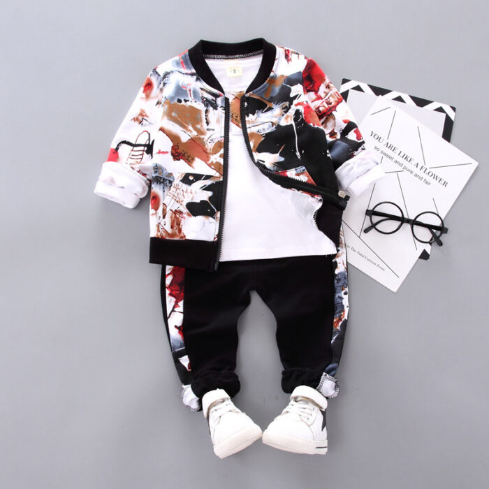 9231e752-83e7-4cd2-9199-35c850a7d01b.jpg A happy little boy wearing a stylish toddler boy 3 piece outfit ready for a family party from K&K Trend Wear.