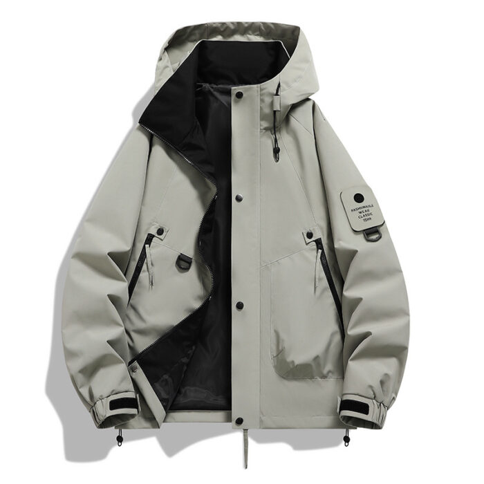 A stylish man wearing a practical mens waterproof windbreaker jacket to protect against the rain and wind from K&K Trend Wear.