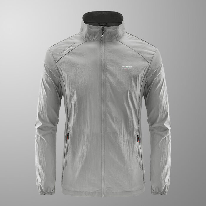 bb862830-d66d-4c8f-bfd2-ed4343de0656.jpg A man outdoors wearing a versatile mens uv protection fishing jacket for summer sun protection from K&K Trend Wear.