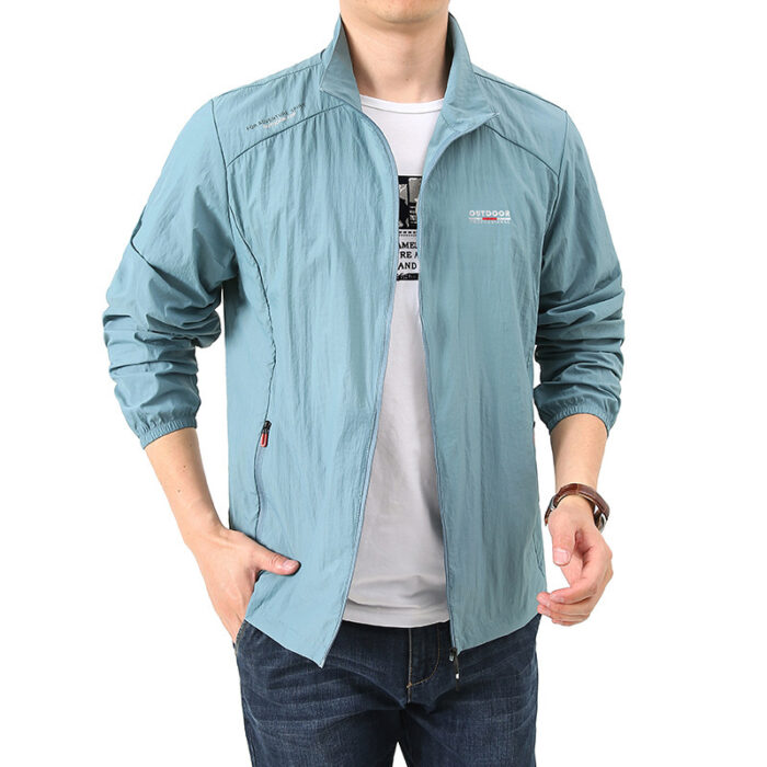 c4a8b841-61f8-4be0-85d7-1e72d134289e.jpg A man outdoors wearing a versatile mens uv protection fishing jacket for summer sun protection from K&K Trend Wear.