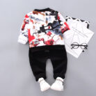 A happy little boy wearing a stylish toddler boy 3 piece outfit ready for a family party from K&K Trend Wear.