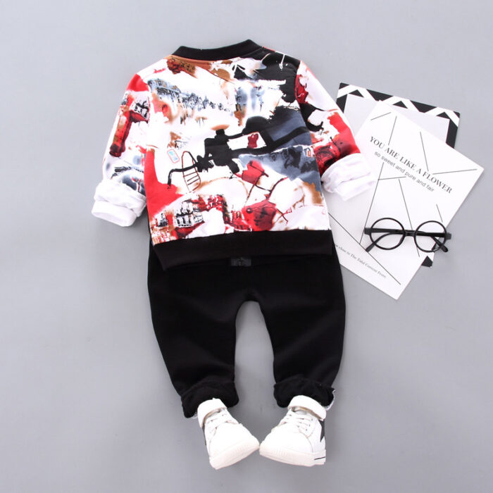 ceee9dff-da23-4c2d-a850-78e9d1dc5ee9.jpg A happy little boy wearing a stylish toddler boy 3 piece outfit ready for a family party from K&K Trend Wear.