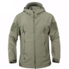 A man exploring the outdoors wearing a durable mens waterproof softshell jacket for maximum weather protection from K&K Trend Wear.