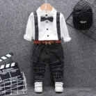 A handsome little boy ready for a special occasion wearing a toddler boy formal suspender outfit from K&K Trend Wear.